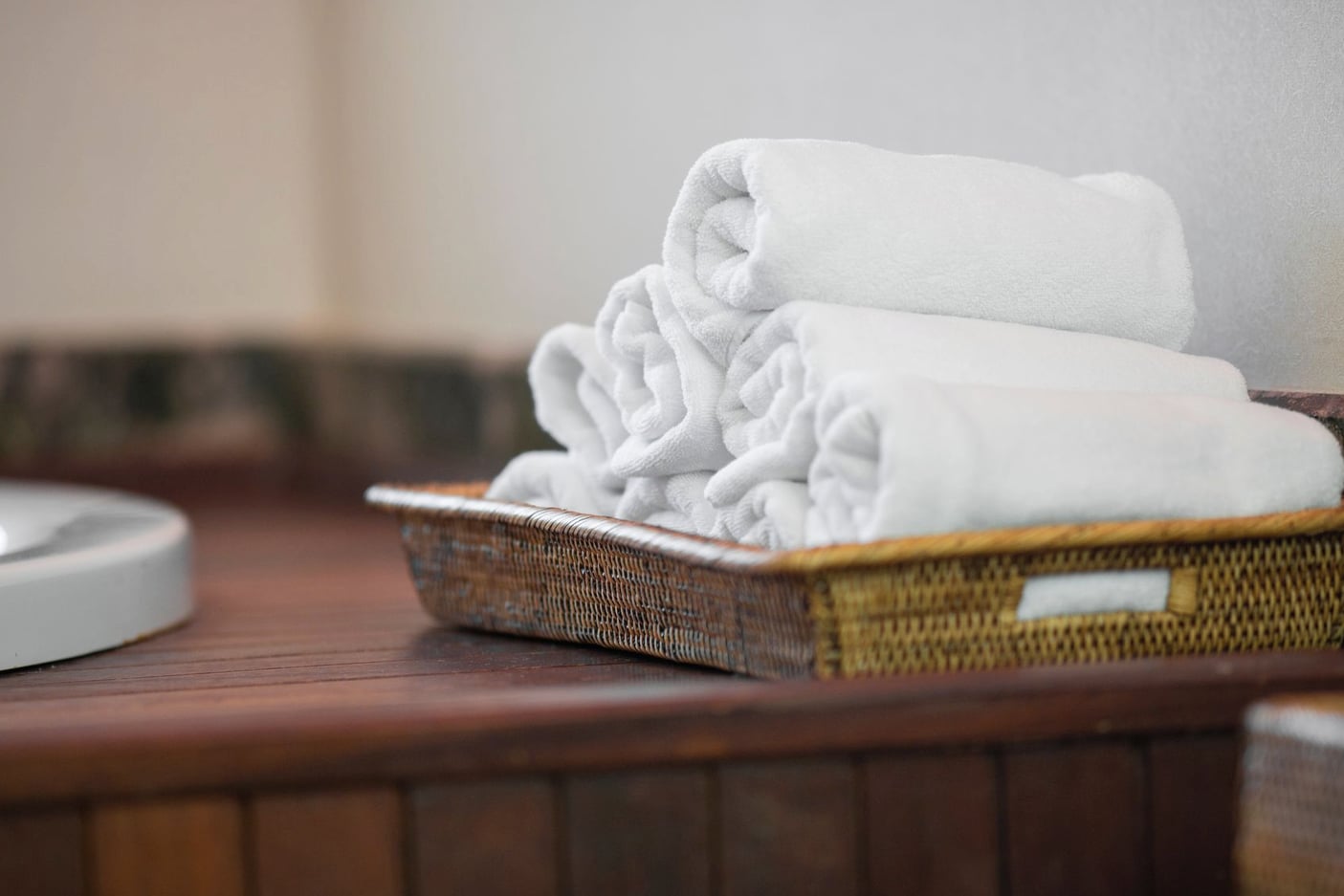 Rolled towels and a foam roller stored for recovery sessions